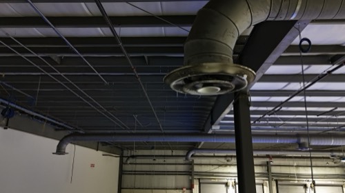 Overhead ductwork and structure throughout the bay