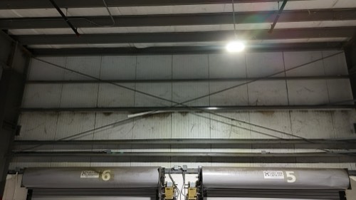 Dust and cobwebs above the loading dock doors