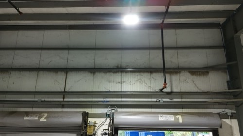 Dust streaking above the loading dock doors